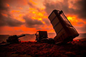 War concept. Battle scene with rocket launcher aimed at gloomy sky at sunset time. Rocket vehicle...