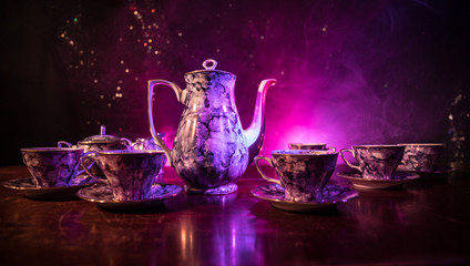 Food background tea and coffee theme. Old vintage ceramic tea or coffee pot with cups jug and sugar...