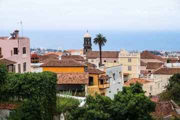Obraz premium View over acient buildings with churchtower with view to the sea in Orotava, Tenerife