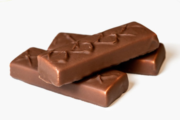 chocolate bars over white background