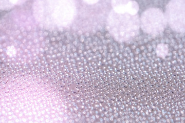 Brushed metal surface with water drops