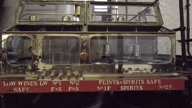 Antique shiny brass feints and spirits safe with controls   distillery