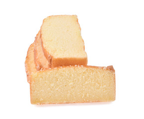 Sliced butter cake on white background