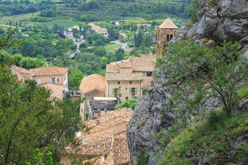 Fototapeta na wymiar French ancient city in Provence. Connected with the legend of the golden star stretching between the rocks. The city is one of the centers of French porcelain. Moustier St. Marie. France.