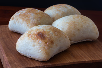 four white bread rolls