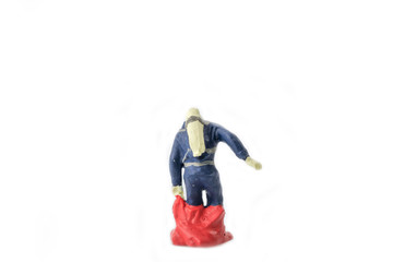 Miniature people  firefightes in hazmat suits construction concept