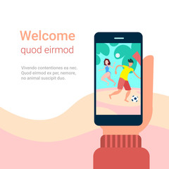 hand hold smartphone app couple playing beach games online mobile application cartoon character copy space flat vector illustration