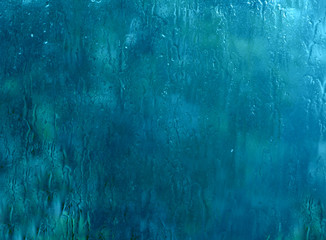 drops and rain droplets on the window, beautiful abstract background, toned image