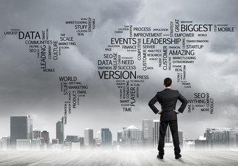 Motivation and inspiration concept with modern cityscape and businessman observing it
