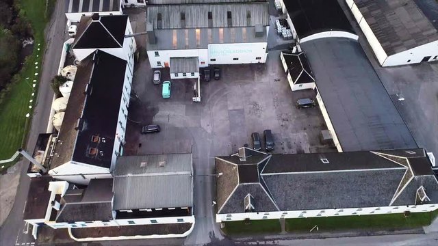 Flying Over a Distillery in Islay Scotland