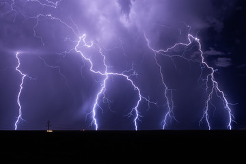 Lightning bolts strike from a monsoon storm near Willcox, Arizona.