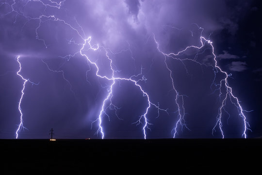 Lightning bolts strike from a monsoon storm near Willcox, Arizona.