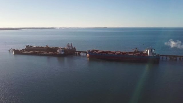 Aerial shot of ships being loaded with iron ore in the Pilbara region of Western Australia