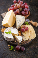 Cheese with nuts and grapes