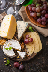 Cheese with nuts and grapes