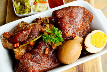 Braised pork leg or Thai style Stewed pork leg (Thai name is Kha Moo Pa Lo).
Pork leg street food menu in Thailand.