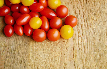Colorful 3 kind of tomatoes on wooden floor.