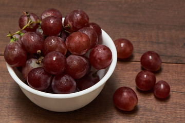 Delicious grapes in a white bowl