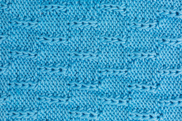 knitted fabric background in turquoise cotton yarn