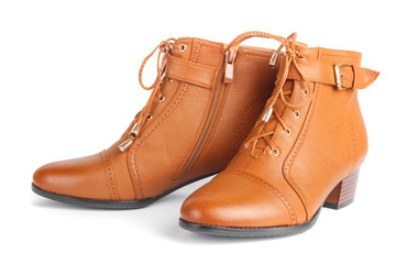 Pair of brown female boots isolated on white background