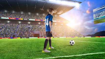 kid football player prepairing to take a shot on a football field