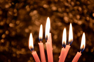 A lot of Birthday candles light with Bohke background in the dark room