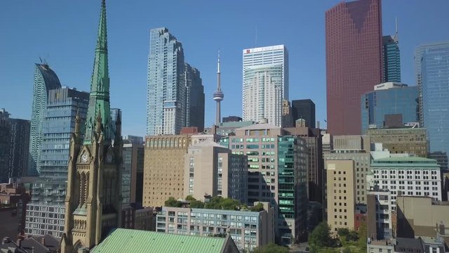 rising over church view of Toronto skyline