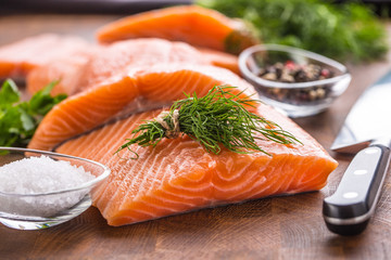 Raw salmon fillet with dill lemon olive oil salt and pepper