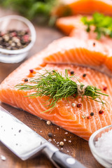 Raw salmon fillet with dill lemon olive oil salt and pepper