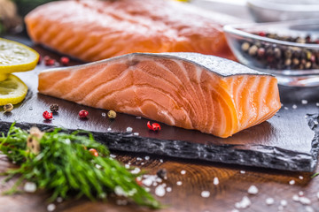 Raw salmon fillet with dill lemon olive oil salt and pepper