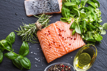 Raw salmon fillet with rosemary basil olive oil salt and pepper © weyo