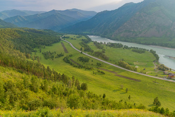 Summer mountains and the Altai river at sunset