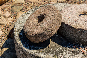 old stone millstones