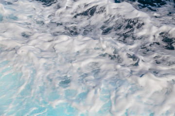 Sea water foaming behind the boat