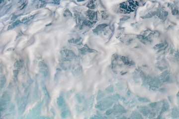 Sea water foaming behind the boat