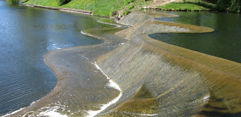 Waterfall on the city channel. Minsk.