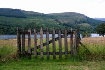 Fototapeta na wymiar Old Timber Gate to a Scottish Loch Side