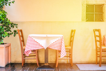 A table of a summer cafe on the street of a European city. Glare