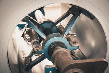 Roll of galvanized steel sheet close up, ironworks and metalwork manufacturing factory