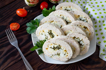 Meat roll (roulade) with egg and greens. Thanksgiving day appetizer. Copy space.