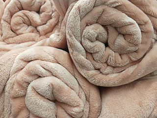 texture of a rolled pink blankets