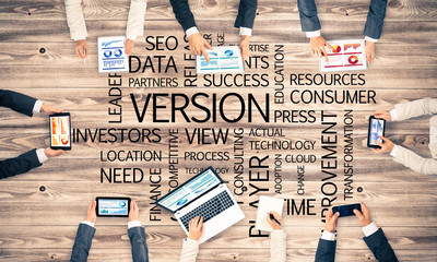 Top view of businesspeople sitting at table and using gadgets