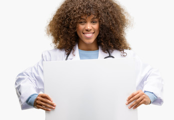 African american doctor woman, medical professional working holding blank advertising banner, good...