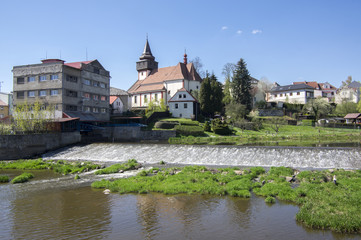Naklejka na ściany i meble Church of St. Wenceslas in town Svetla nad Sazavou, clock tower, greenery and blue sky, river Sazava