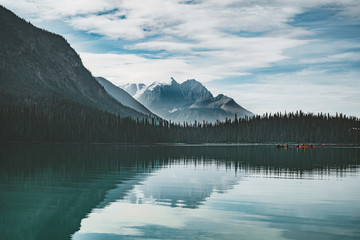 Fototapeta na wymiar Emerald Lake in Canadian Rockies with mountains and lake and trees. Concept of active vacation and tourism.