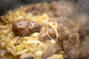 Mutton meat fried with onions