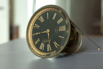 golden vintage clock with black face