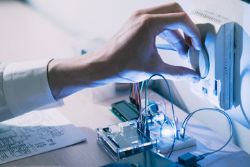 smart home technology engineering. . efficient living design. hand testing a custom made automated...