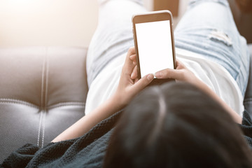 blank screen smartphone mock up.woman holding mobile phone with blank screen for insert graphic objects.chatting message with device.