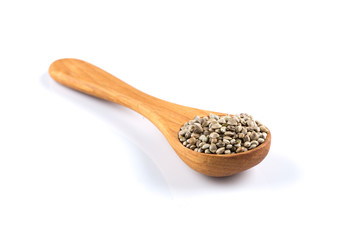 Cannabis Hemp seeds in spoon on white